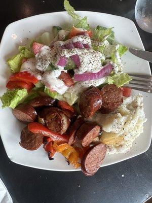 Sausage, mash potatoes, side salad.