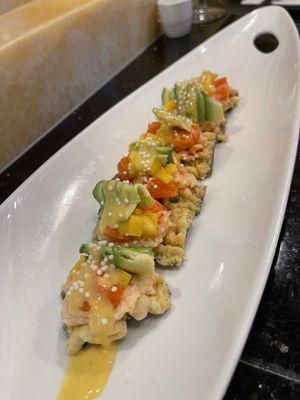 Special made cracker with salmon, avocado and mango