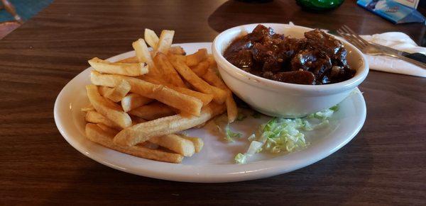 Beef tips with fries, with iceberg lettuce "garnish".  Meat was OK, fries were mildly warm.