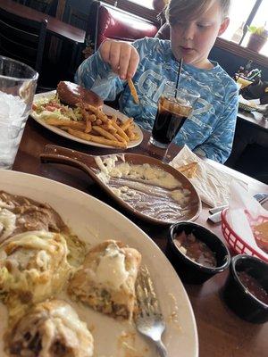 Meals with chips, salsa and queso dip.