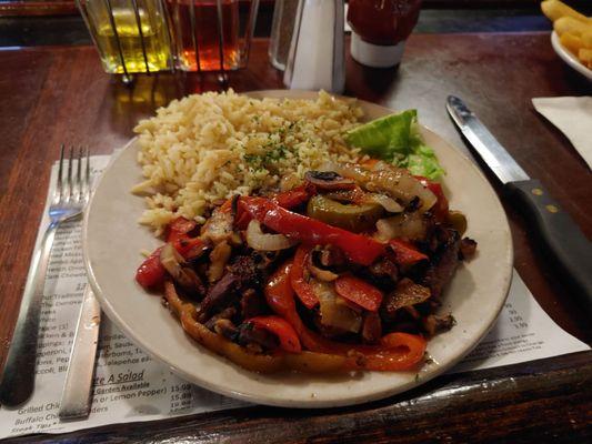 Steak tips with peppers and onions and rice pilaf, divine