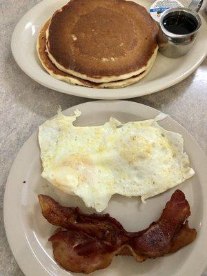 Texas Two Step $8.29, 2 pancakes, 2 eggs, 2 bacon strips. Yum!