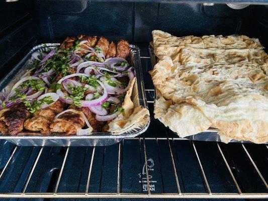 Beef and chicken lula kebab covered with lavash