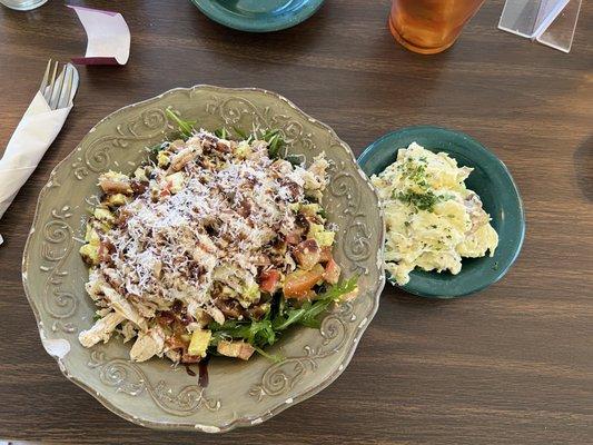 Caprese-style salad with grilled chicken and a side of fresh potato salad