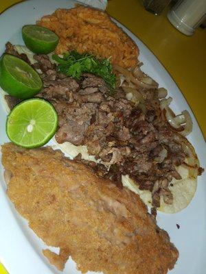 Steak tacos, fried refried beans and rice.  Also comes with a half of fresh avocado, but he asked them to leave it off- he is not a fan.