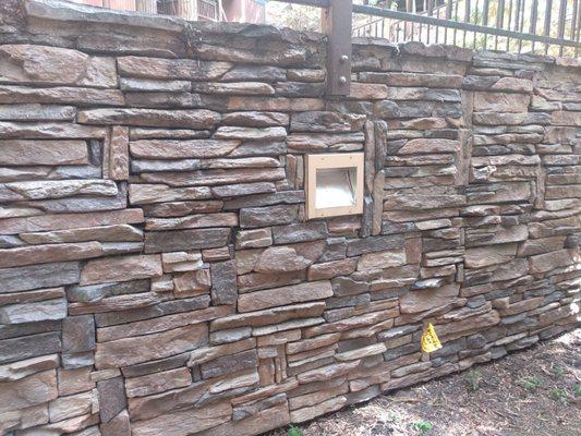 Retaining wall with stack stone guardrails and lights