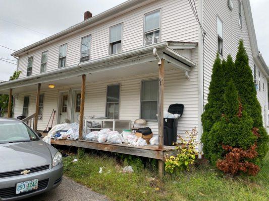 Two-three months of trash on the porch of a property they manage.  The apartment floors are caving in and there's significant black mold.