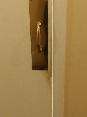 Inside mens room handle