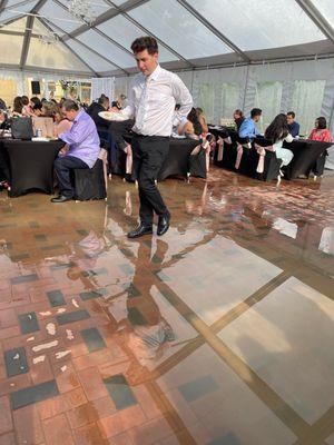 Outdoor tent dinner area flooding.