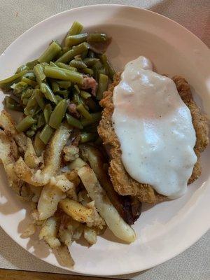 Chicken fried steak, skillet potatoes and green beans