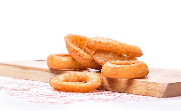 Sweet, thick-cut onion slices are beer battered and fried golden after you order.