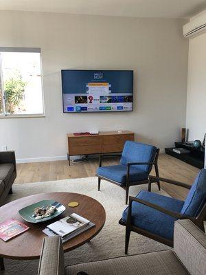 75 inch Television Wall Mounted on a dry wall with all wires hidden for a modern home in West Hollywood, CA 90048