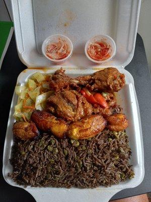 Fried chicken sweet plantain cabbage and black rice....  Love hatian food best of all nations