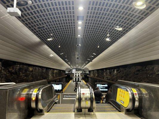 One more set of escalators take riders down one level.