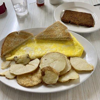 Cheese omelet with hash browns and toast. Side of scrapple.