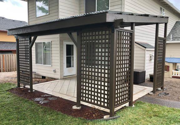 Awning in Hillsboro, OR.  Suntuf panels and with privacy screens.