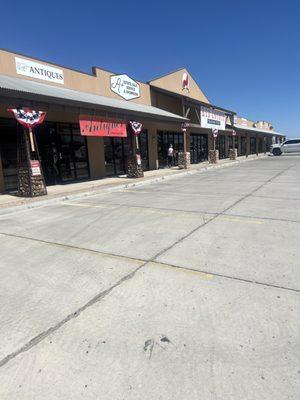 A Plus Estate Sales and Antiques  is located next to Red Coyote Trading Post