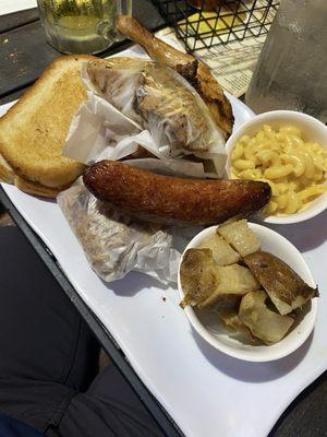 Sampler Meat Plate with chicken, wings, sausage, brisket, ribs, garlic bread, sides, etc