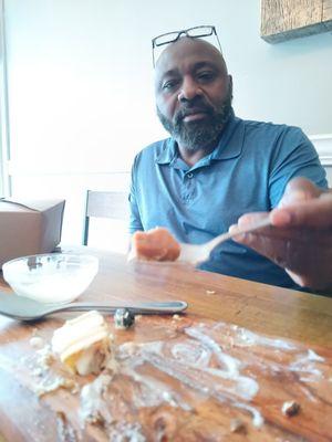 I didn't take a before picture of our desserts, but this is my husband taking one more bite after saying he can't eat one more bite