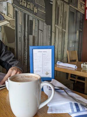 Mocha in front of drink menu