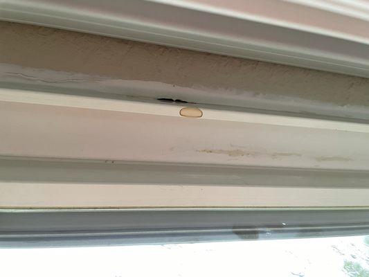 Top of the window where the water broke through the caulking and is leaking through