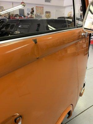 1974 VW Bus - Top of Door Dent with cracked paint. Repaired dent only.