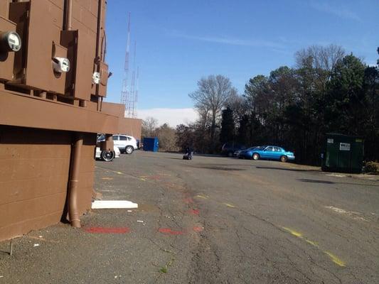 Motorcycle testing pad.. Potholes, dumpster and all.