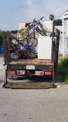 A second truck to haul the appliances and assorted trash.