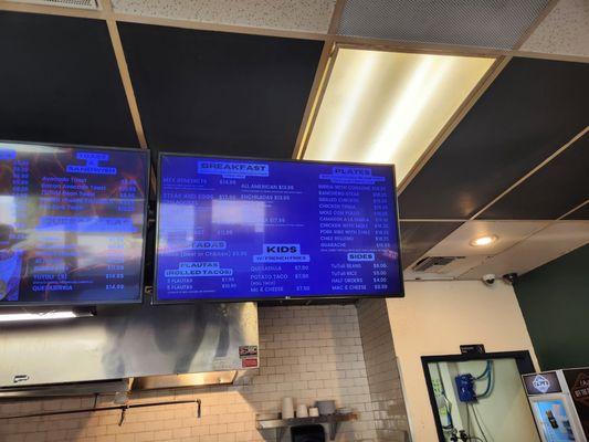 Deciphering menu from overhead lights.