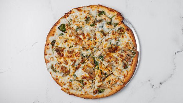 Halal-certified dish with Alfredo sauce, tender baby spinach, halal chicken, mushrooms, and a perfect blend of halal mozzarella and cheddar