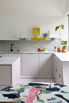 Countertops with flush, curved inset backsplash.