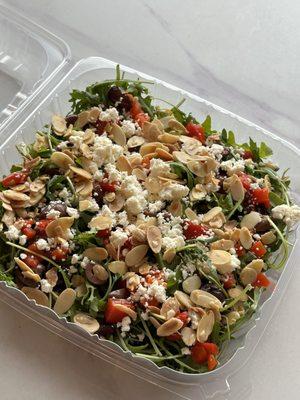 Arugula Salad with roasted bell pepper, kalamata olive, toasted slivered almonds, feta, and meyer lemon dressing