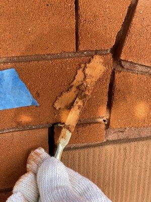 Brick patching mortar after units were stabilized with injection grout.  Material is customized to the colors for visual accuracy.