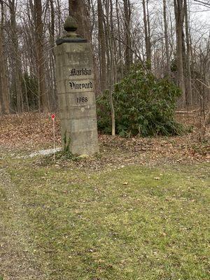 Driveway post at road entry