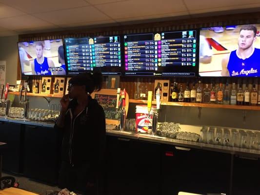 The cute little gal behind the bar, who's very nice. 2 tv's and and the menu on the wall. No one under 21!