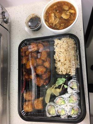 Orange chicken,  brown rice, shumai, California roll, and hot and sour soup.