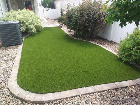 Artificial grass with paver surround in Denver.