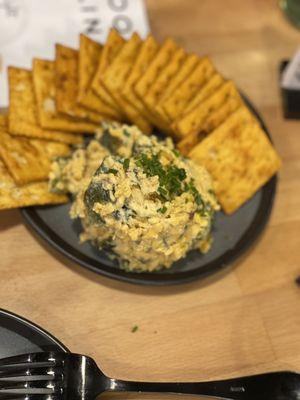 Poblano pimento cheese served with firecrackers crackers . DELICIOUS