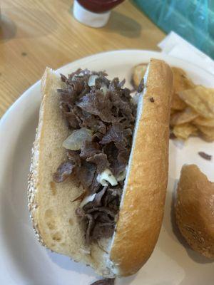 Cheesesteak with cheese and fried onions