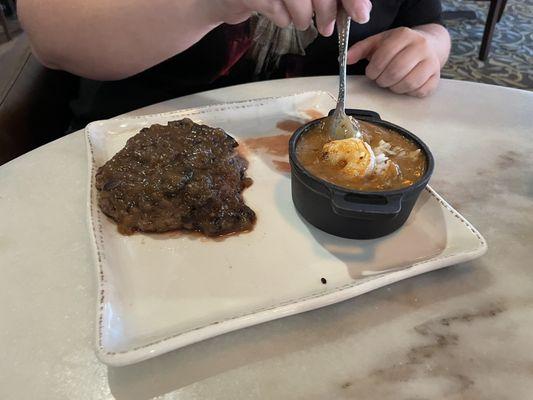 Salisbury steak with a bowl of gumbo