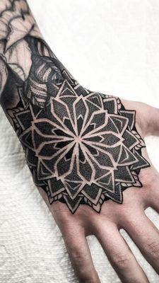 Mandala hand tattoo