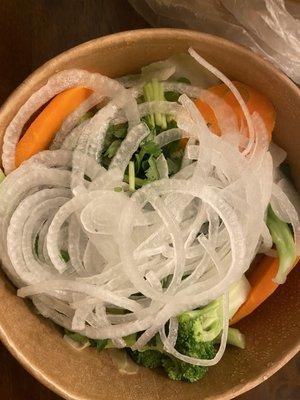 The noodles are tucked under lovely steamed veggies.