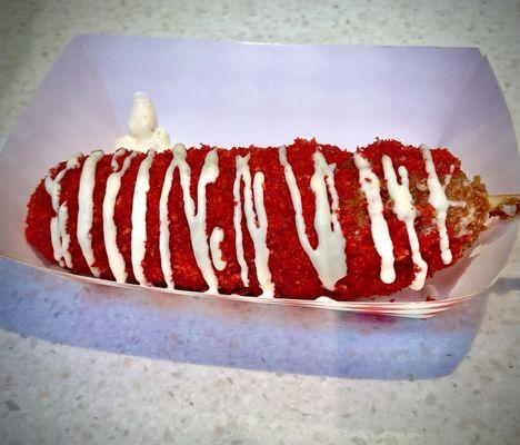 Hot Cheetos corn dog with a drizzle of ranch.