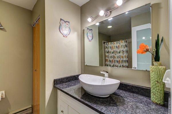 Bath with vessel sink at Cedar Lodge