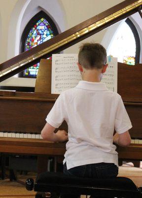 A student plays in the spring recital.