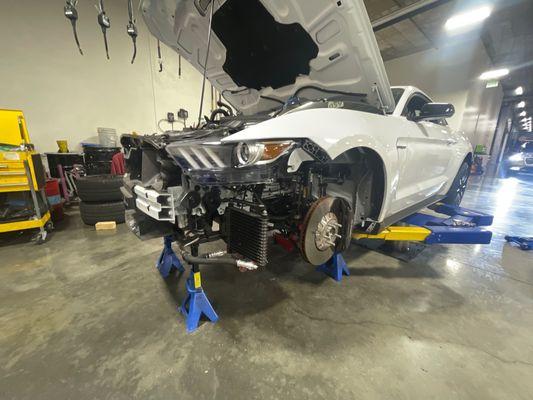 Car on rack as Clay prepares to drop drivetrain from below