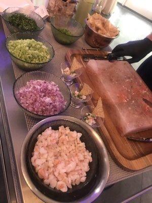 Freshly made ceviche on a salt board Not only delicious but also very fun to watch the freshness happen in front of your eyes!