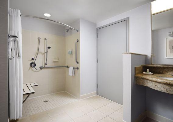 Roll-in shower with bulk amenity