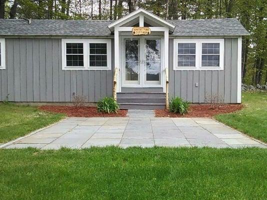 Bluestone patio with granite edging. Mulching and plantings