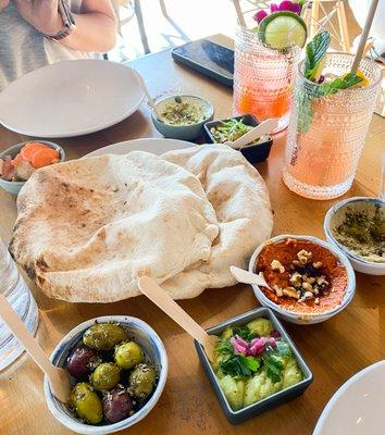 salatim: 2x fresh baked pita + mix and match spreads: feta & pistach, baba ganoush, favs dip, muhamarra (pepper spread), olives, fennel slaw